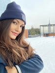 beautiful female model wearing Reversible Knit Hat by ALLREVERSIBLE brand navy and grey with embroidered logo